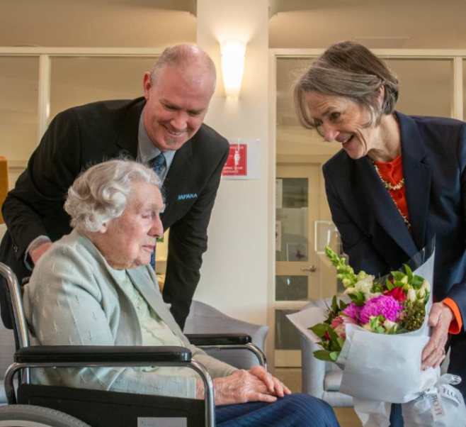 Eileen presenting the Tasmanian Governor, Kate Warner, with flowers