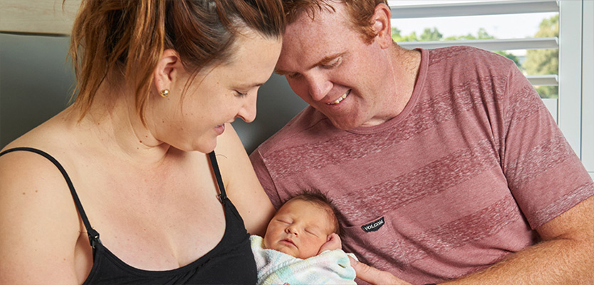 New parents with baby after giving birth at Riverina Hospital